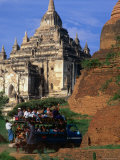 Crowded Pick-Up Carrying Passengers Past Thatbyinnyu Pahto  Old Bagan  Mandalay  Myanmar
