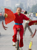 Fan Fluttering Unicyclist on the Bund Promenade  Shanghai  China