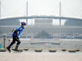 Person Rollerblading Past World Cup Stadium  North of River  Seoul  South Korea