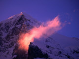 Eiger Mountain Looms in Purple Sunrise Light with Streaking Ridge Clouds  Bern  Switzerland