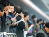 People Studying Form Guide at Seoul Racecourse  Seoul  South Korea