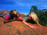Children Lying on a Rock in the Western Desert  Western Australia