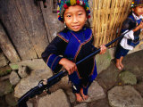Two Ethnic Ha Nhi Girls Carry Locally Made Flint Lock Rifle  Muong Hum  Lao Cai  Vietnam