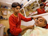 Young Man Shaving Older Man in Indian Barber Shop  Dar Es Salaam  Tanzania
