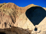 Shadow of Hot-Air Balloon over Barren Landscape Near Goreme  Cappadocia  Nevsehir  Turkey