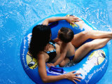 Woman with Child Floating in Pool at Dam Sen Water Park in District 11  Ho Chi Minh City   Vietnam