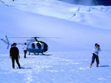 People Sightseeing at Top of Glacier with Helicopter Behind  Fox Glacier  New Zealand