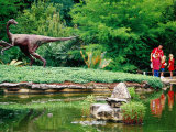 Children and Adult Standing near Ornithomimus Dinosaur Sculpture  Austin  Texas