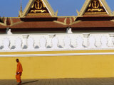 Lone Monk Passes Walls of Royal Palace  Phnom Penh  Cambodia