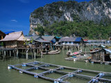 Stilt Village with Net Farms in Front and Karst Formations Behind  Ko Panyi  Phang-Nga  Thailand