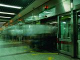 Peak Hour on Singapore's Ultramodern Mrt System at City Hall Station  Singapore