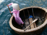 Woman Rows Basket Boat on Vietnam's South Central Coast  Nha Trang  Khanh Hoa  Vietnam