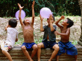 Local Boys Toss Balloons Outside Preah Kahn Temple  Siem Reap  Cambodia