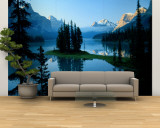 Scenic View of the Lake Surrounded by Evergreens and Snow-Capped Mountains