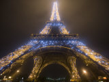 Looking Up at Eiffel Tower in Fog and Rain at Night  Paris  France