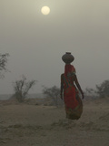 Woman Carrying Water Jar in Sand Storm  Thar Desert  Rajasthan  India