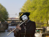 Clown Playing Flute by the Canal  Amsterdam  Netherlands