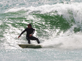 Surfer Goes Right at Tamarack Surf Beach  Carlsbad  California  USA