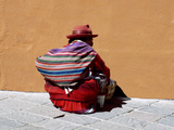 Old Woman with Sling Crouches on Sidewalk  Cusco  Peru