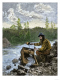 Prospector Washing Pebbles from a Stream Using a Cradle Device to Sparate Gold Nuggets