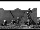 Spanish-American Women Replastering an Adobe House