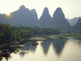 In Guilin Limestone Tower Hills Rise Steeply Above the Li River  Yangshuo  Guangxi Province  China
