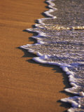 Close-up of Surf on a Sandy Beach