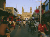 Street Scene with Bicycles and Rickshaw and the Char Minar Triumphal Arch Built in 1591  India