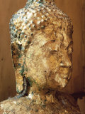 Close-Up of the Head of a Statue of the Buddha Covered in Gold Leaf  Thailand