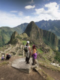 Tourists Looking out Over the Ruins of the Inca Site  Urubamba Province  Peru