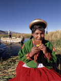 Portrait of a Uros Indian Woman Holding Pipes  Lake Titicaca  Peru
