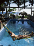 Tourist in Hammock Relaxing Over Pool  Monterico  Guatemala  Central America