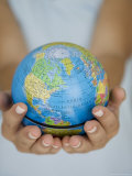 Woman's Hands Holding World Globe