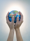 Woman's Hands Holding World Globe