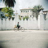 Man on Bicycle with Old Buildings Behind  Stone Town  Zanzibar  Tanzania  East Africa  Africa