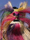 Head and Shoulders Portrait of a Person Wearing a Brightly Coloured Straw Mask  North America