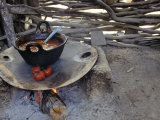 Beans and Tomoatoes Cook over a Fiel  Yucatan  Mexico
