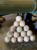 Cannon Balls Stacked Next to the Barrel of a Cannon at the Arsenale  Venice  Italy