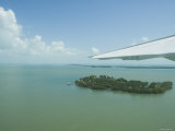 Aerial View of Caribean Sea and Islands with Plane Wing in Sight  Belize