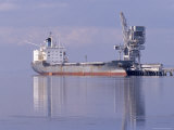 Cargo Tanker Ship Tied Up to a Jetty  Reflecting in the Calm Harbour  Australia