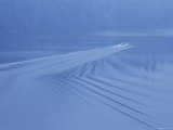 Boat Leaves Waves in its Wake