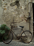 Antique Rusted Bicycle Leans against a Stone Wall  Asolo  Italy