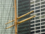 Buildings Behind the Mast of a Sailing Ship at South Street Seaport  New York  New York