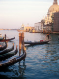 Gondoliers on the Grand Canal at Sunset  Venice  Italy