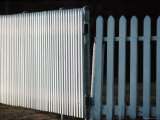 Detail of a White Picket Fence