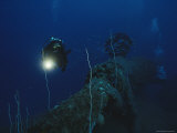 Diver Swims Past the Upside-Down Stern of the Japanese Battleship Nagato