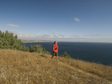 Hiker on Trail Looking at Ocean from Bluff  California