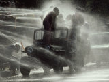 Jeep Full of Innocent Onlookers is Sprayed with Water During the Water Festival
