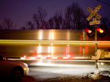 Nighttime Warning Lights Warn of a Blurred Passing Train  Silver Spring  Maryland