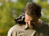 Man Holds a Spotted Skunk in Missouri